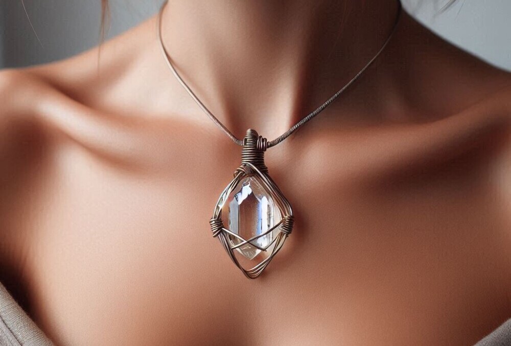 A woman wearing a handmade wire wrapped crystal pendant